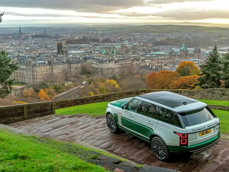 Range Rover parked on a hillside above the Edinburgh skyline in autumn