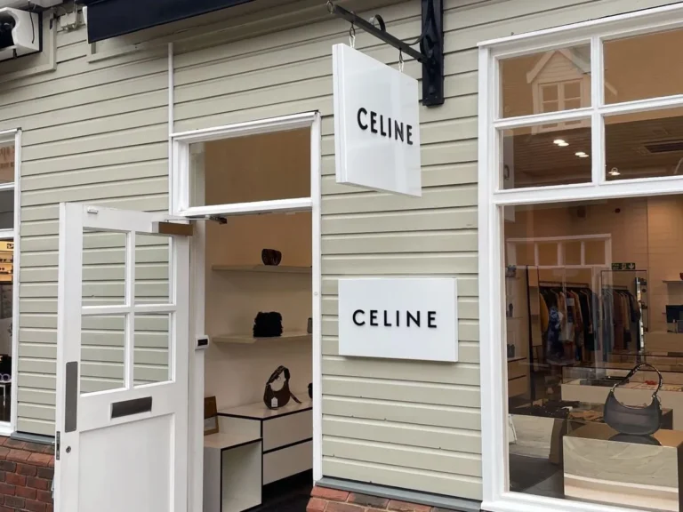 The entrance and hanging sign of the Celine boutique at Bicester Village