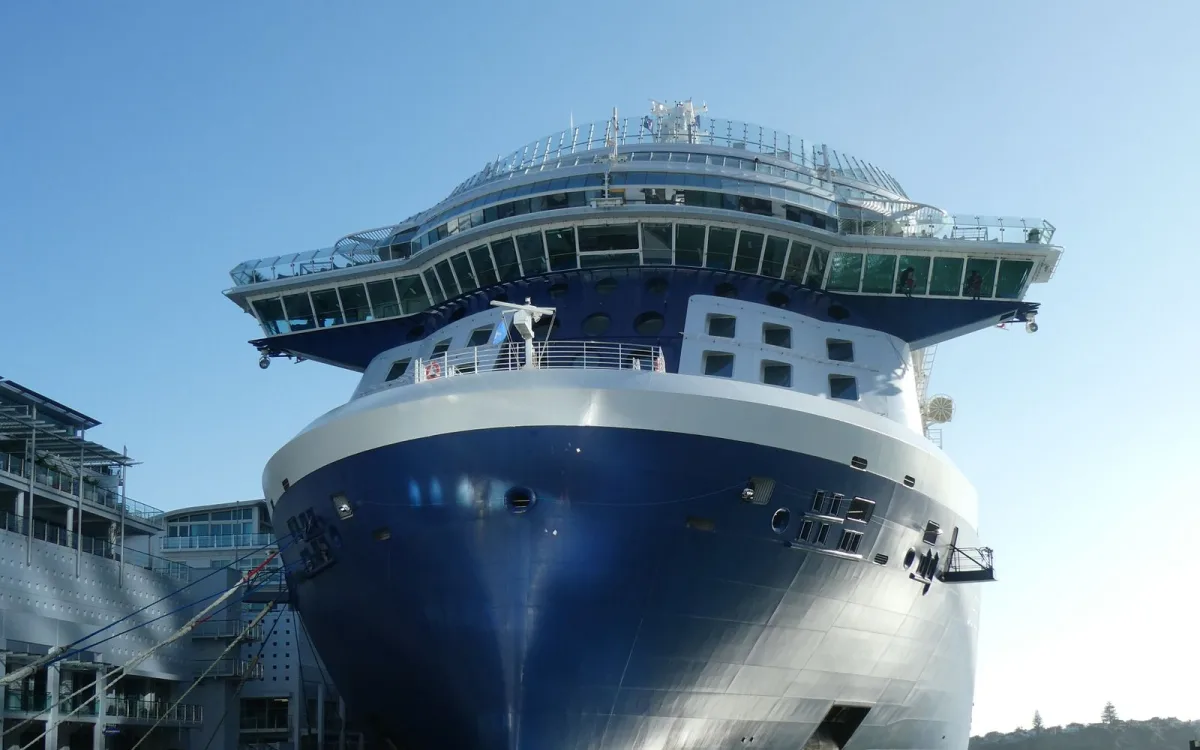 Large cruise ship docked at the port on sailing day