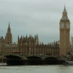 Big Ben and Westminster Bridge in London under a grey winter sky