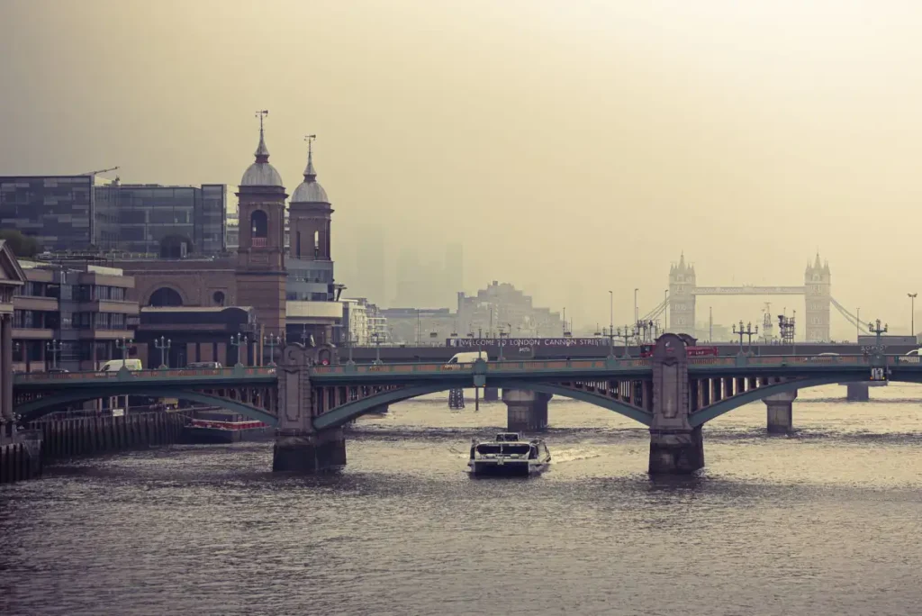 Tower Bridge and the River Thames under low autumn mist in London