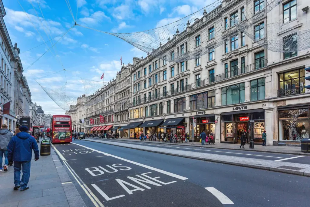 Shoppers and double-decker buses on Regent Street in London during the January sales