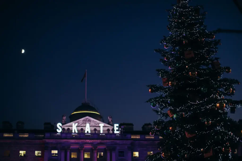 The Christmas tree and ice rink lit up at Somerset House in London in December