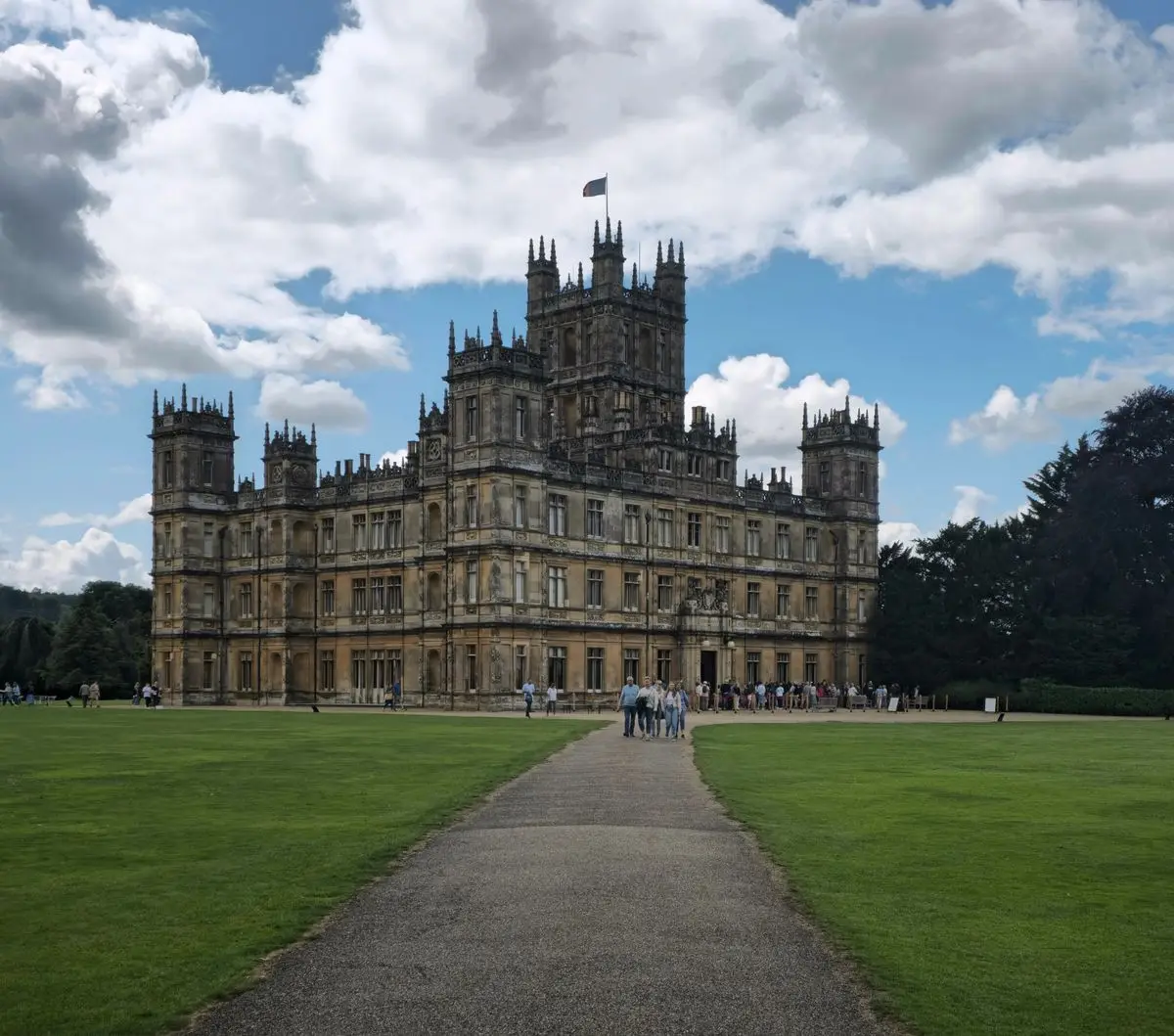 Highclere Castle in Hampshire with its central tower and the long lawn in front