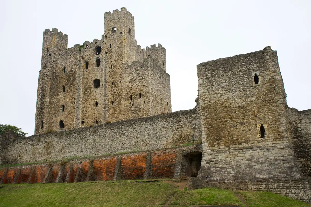 The Norman stone keep of Rochester Castle in Kent above its curtain wall