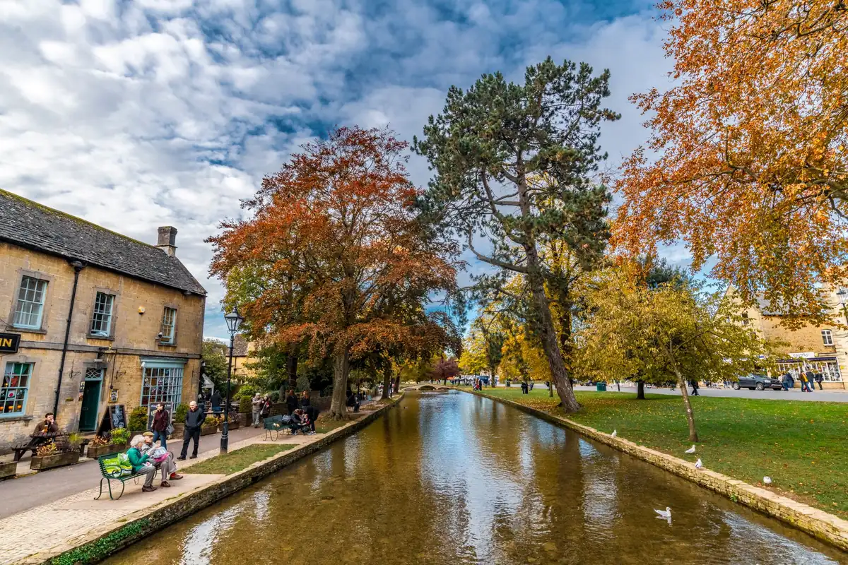 Cotswolds tour: autumn trees along the River Windrush in Bourton-on-the-Water