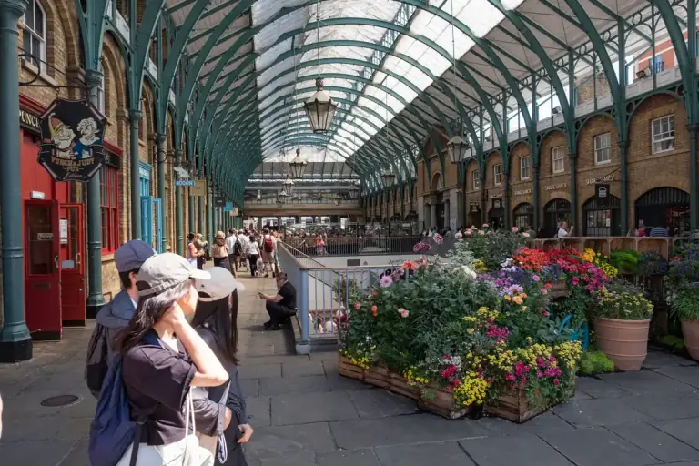 Flower displays in the Covent Garden market hall, London — the city in bloom during Chelsea Flower Show week