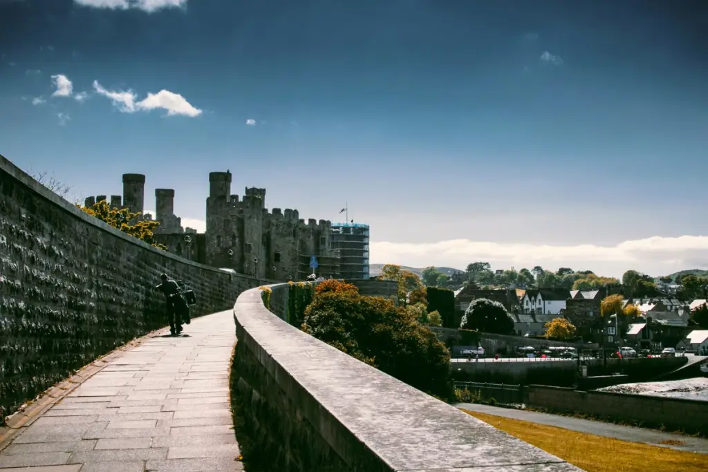 Walkers on the Conwy town walls heading towards Conwy Castle, a day-two option in North Wales