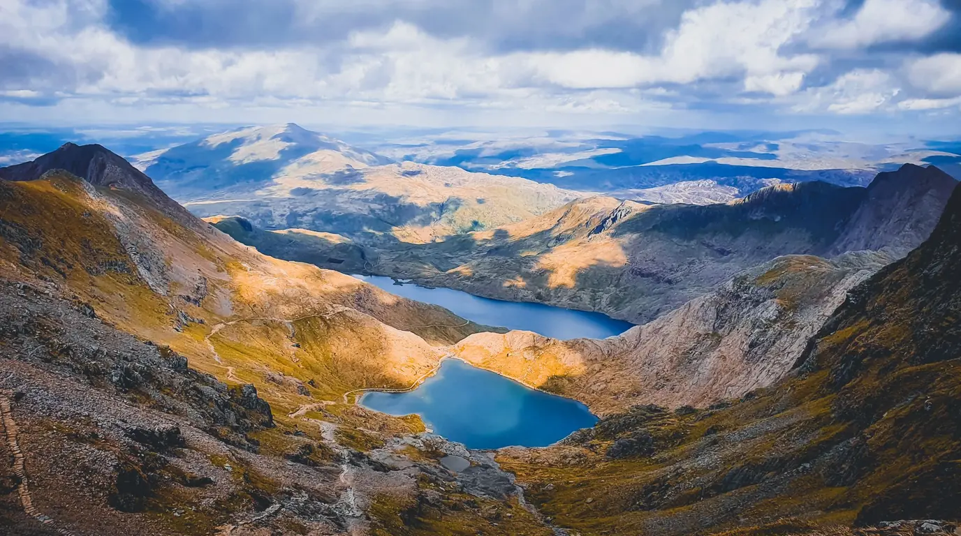 Mountain lakes below the peaks of Eryri (Snowdonia), North Wales, on a 2-day private tour from London