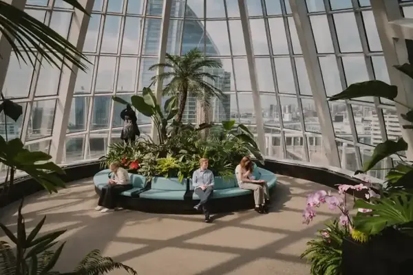 Visitors among the plants inside the glass dome of the Sky Garden