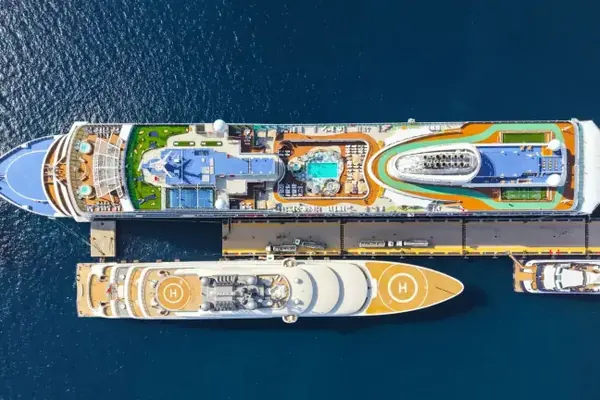 Two cruise ships berthed side by side, seen from above